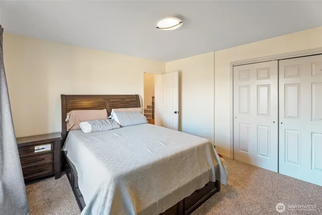 a living room with furniture a couch and a window