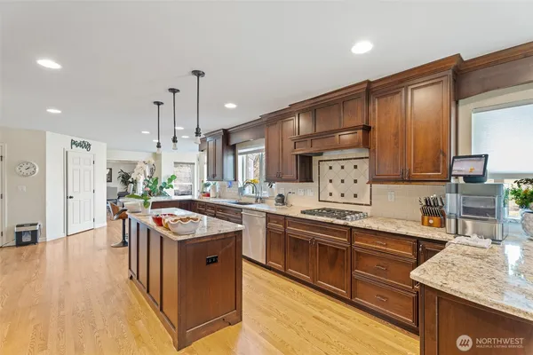 a kitchen with refrigerator and cabinets