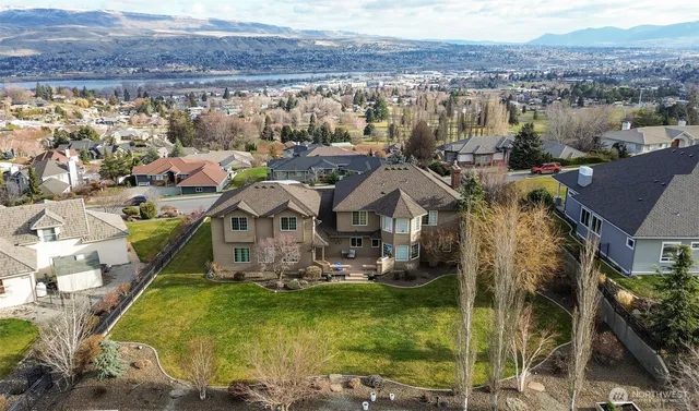 a view of a town with mountains in the background