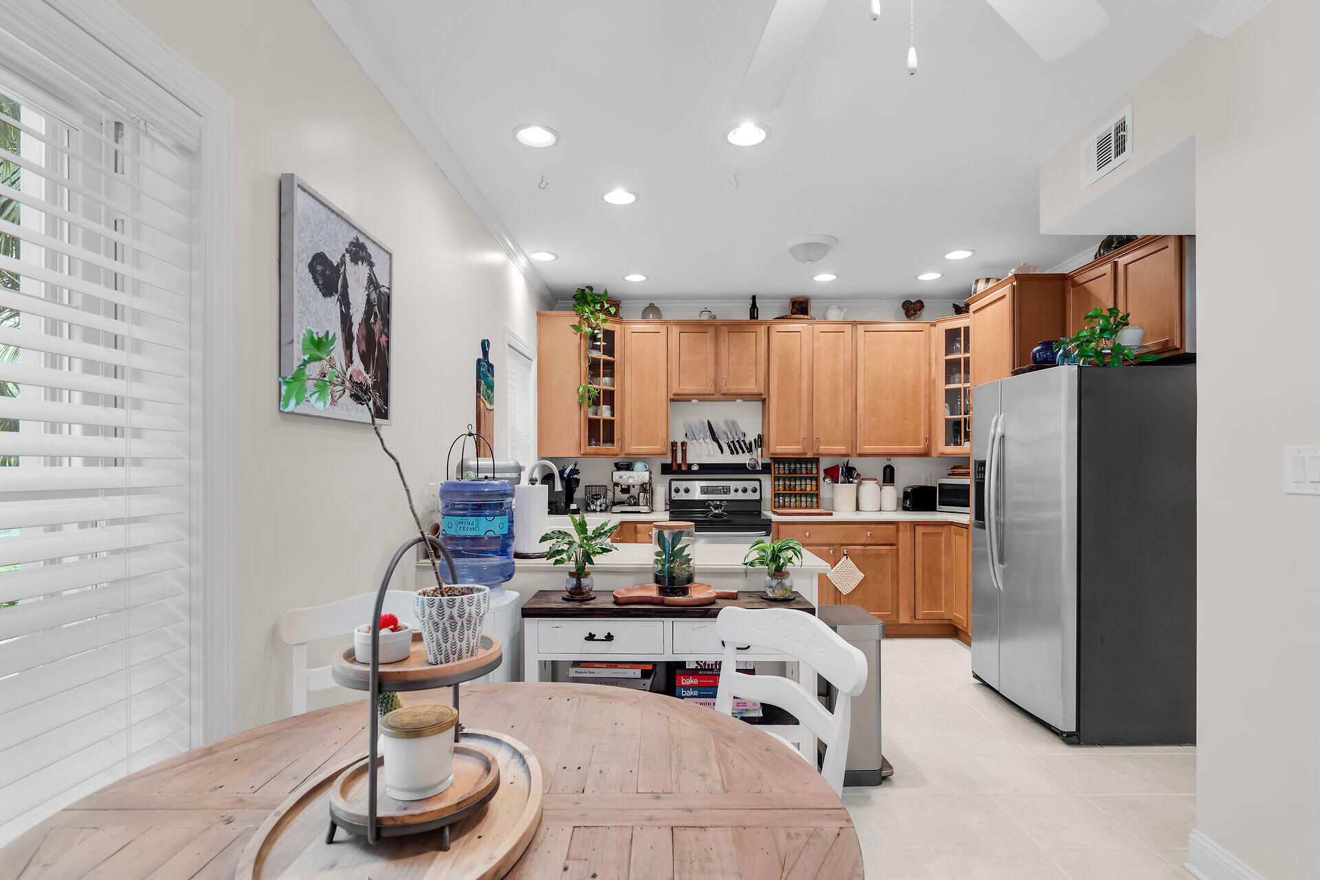 320 24th Street Ocean Marathon, FL 33050 - Photo 28 of 46 a kitchen with stainless steel appliances wooden floor dining table and chairs