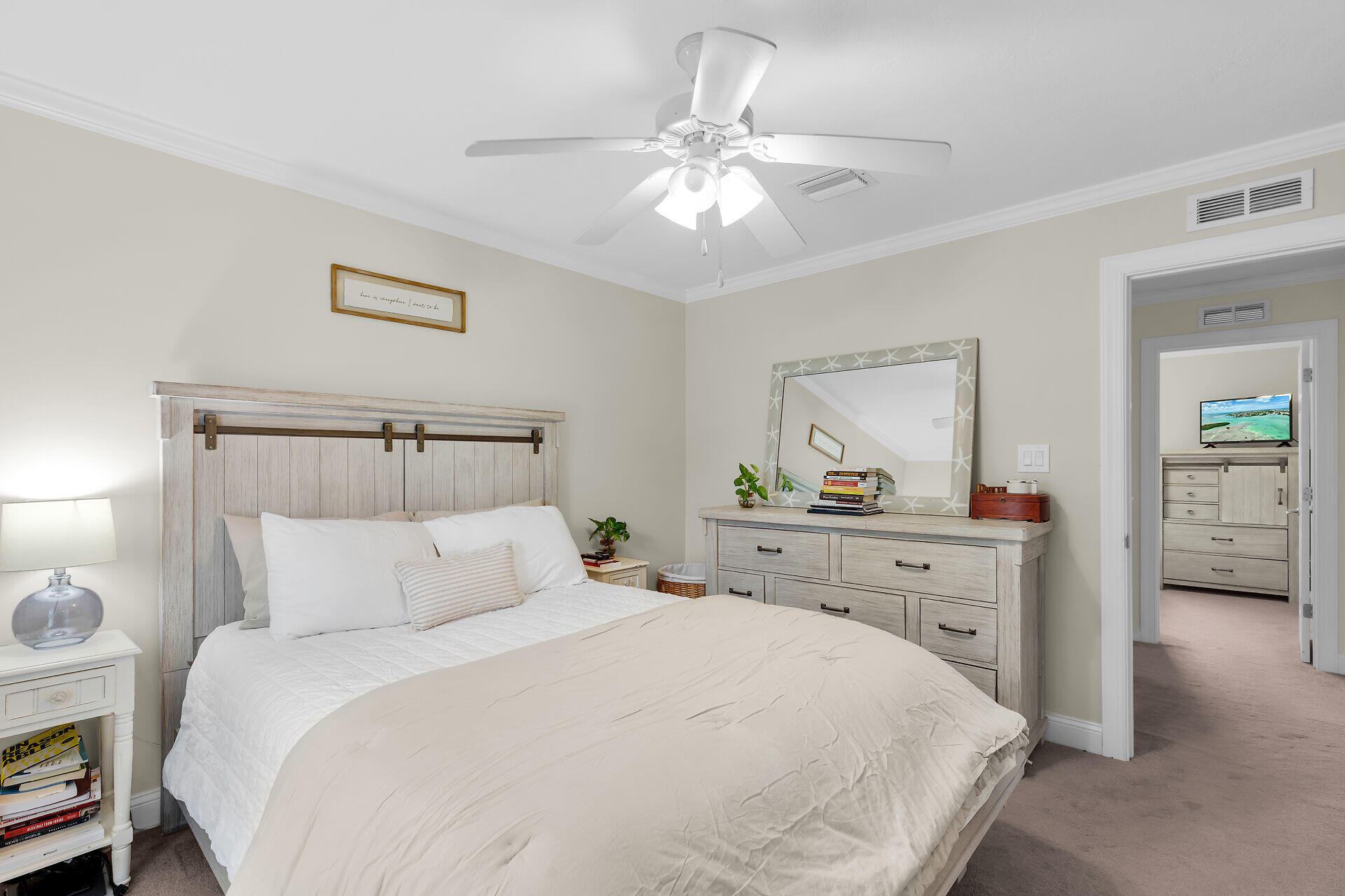 320 24th Street Ocean Marathon, FL 33050 - Photo 33 of 46 a bedroom with a bed and a chandelier