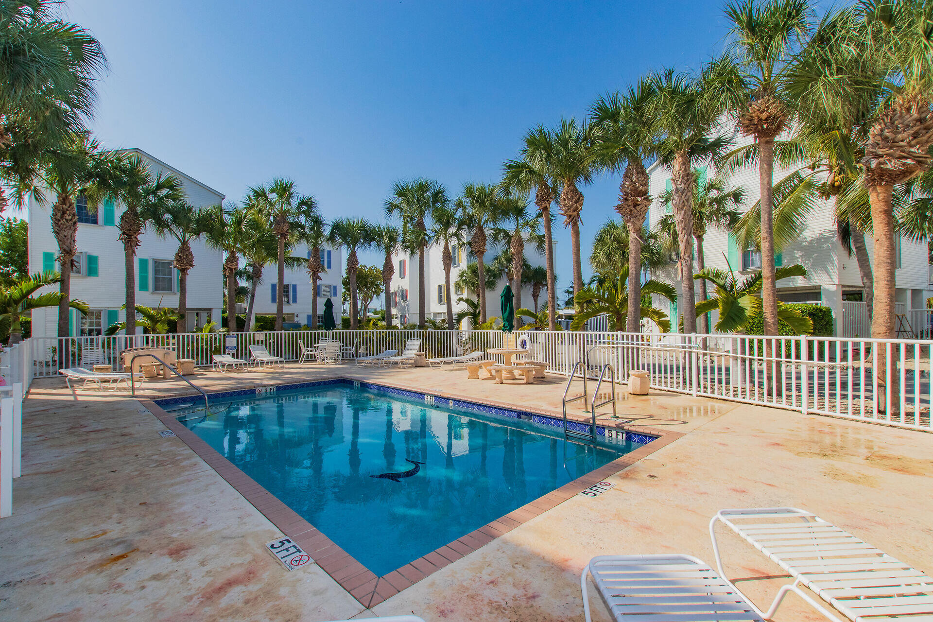 320 24th Street Ocean Marathon, FL 33050 - Photo 42 of 46 a swimming pool with outdoor seating and yard