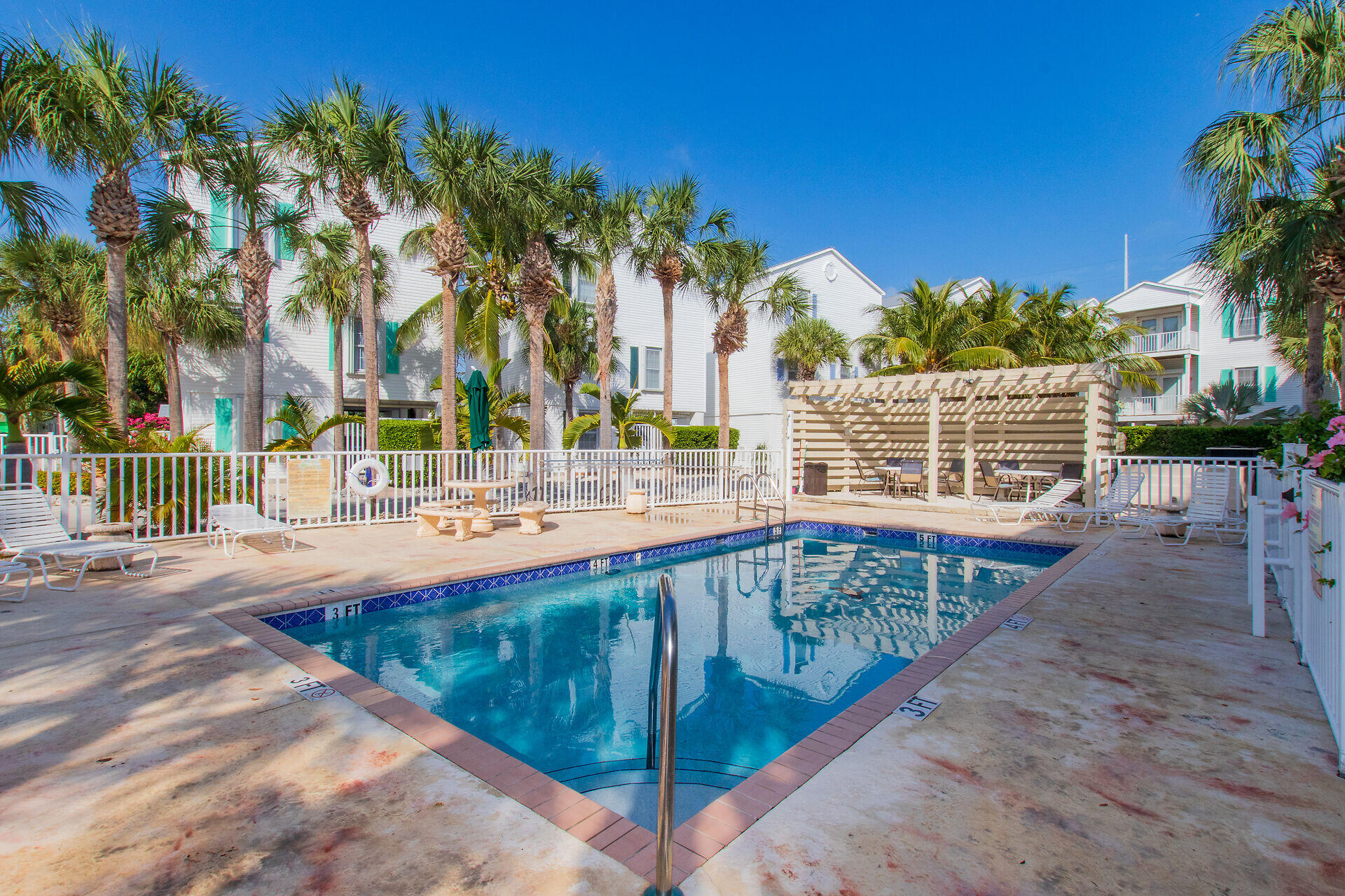 320 24th Street Ocean Marathon, FL 33050 - Photo 6 of 46 a view of swimming pool with outdoor seating and a pathway