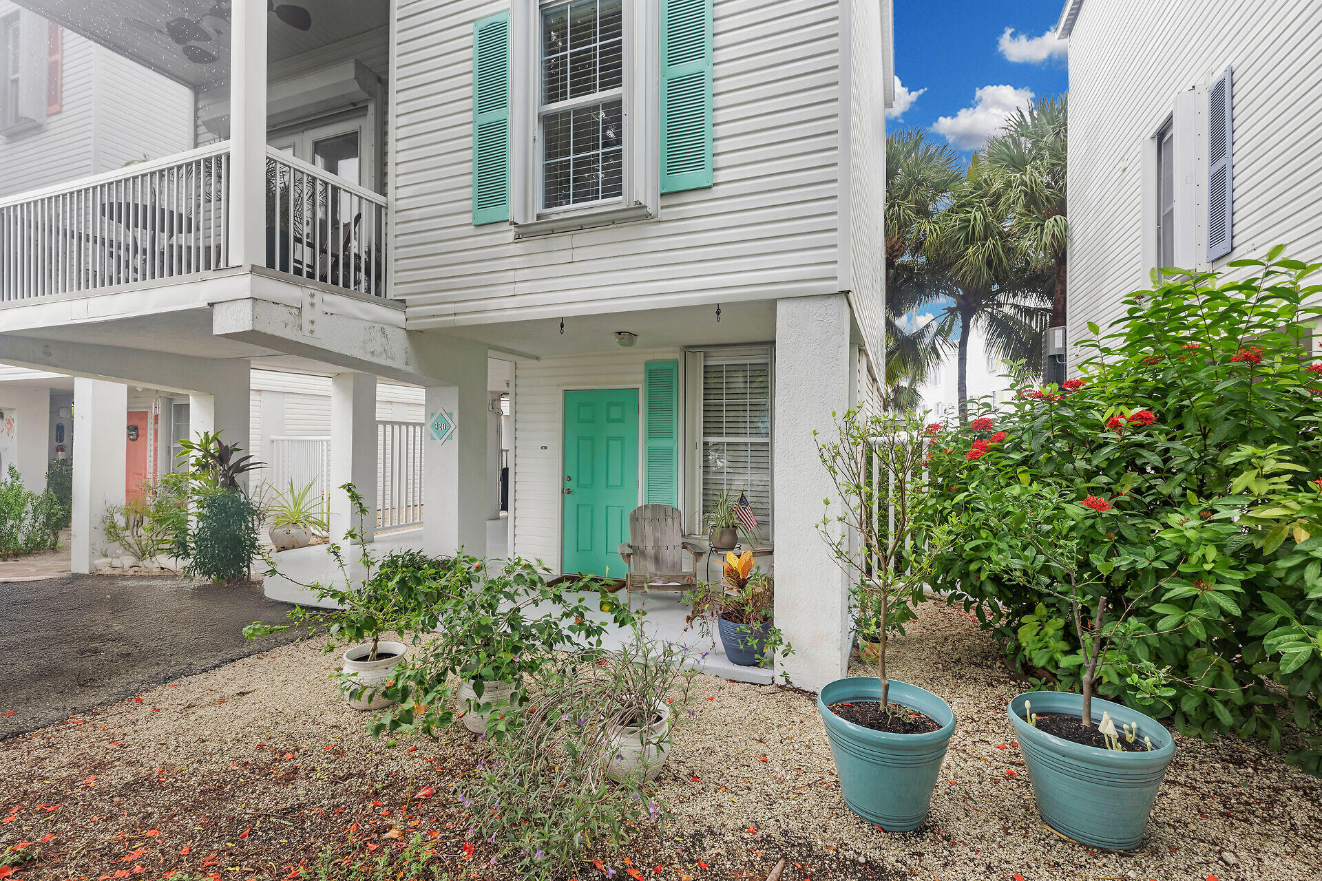 320 24th Street Ocean Marathon, FL 33050 - Photo 8 of 46 a view of a house with patio and potted plants