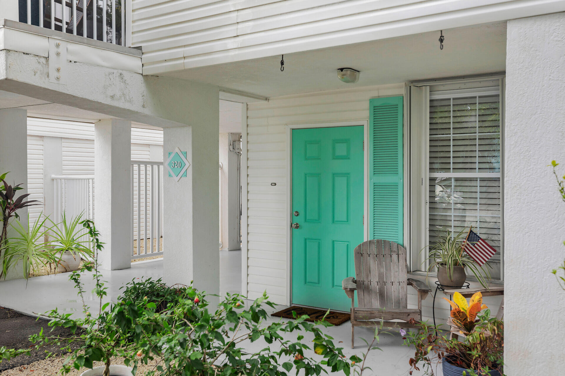 320 24th Street Ocean Marathon, FL 33050 - Photo 9 of 46 a view of a backyard with plants and a potted plant
