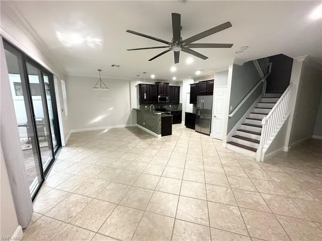 a view of an entryway and livingroom in a hall