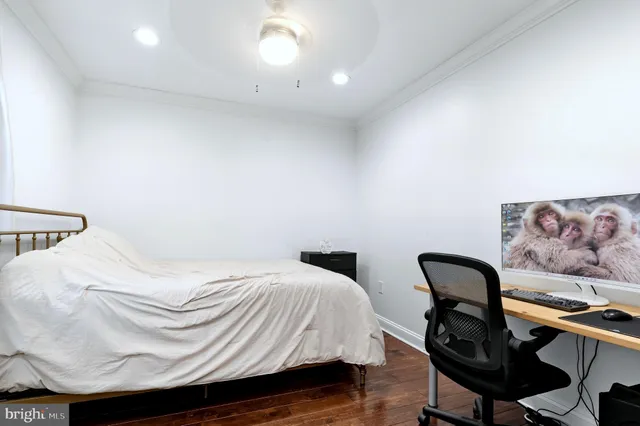 a bedroom with a bed and a chair