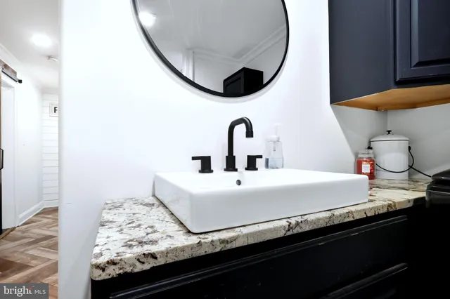 a bathroom with a sink and a mirror