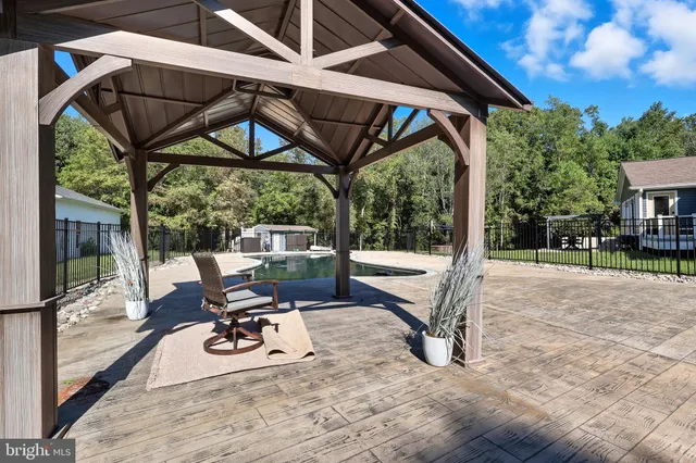 a view of a chairs and table in the patio