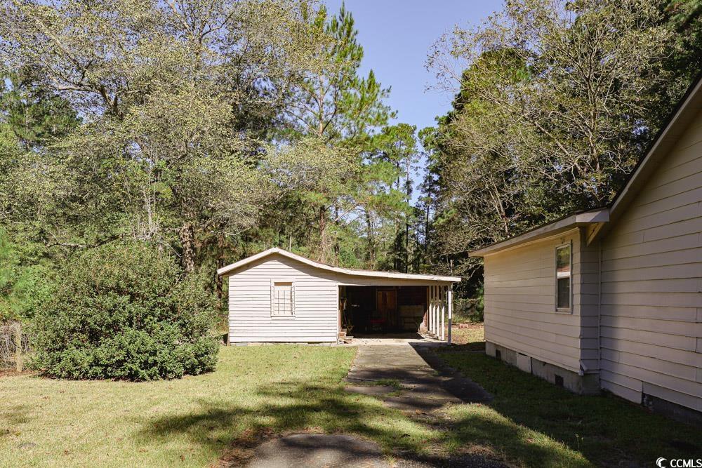 8444 Franklin Drive Conway, SC 29527 - Photo 32 of 34 View of green lawn with a carport