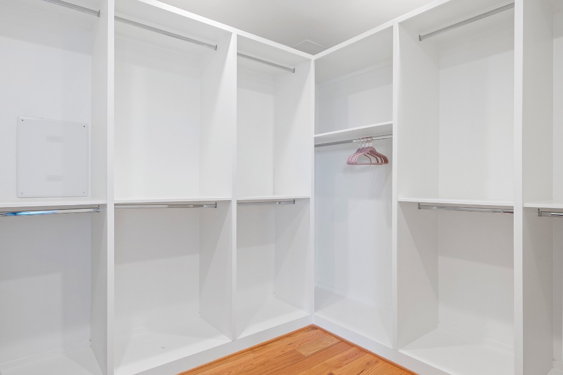 2239 North MacGregor Way Houston, TX 77004 - Photo 20 of 39 a view of walk in closet with empty racks