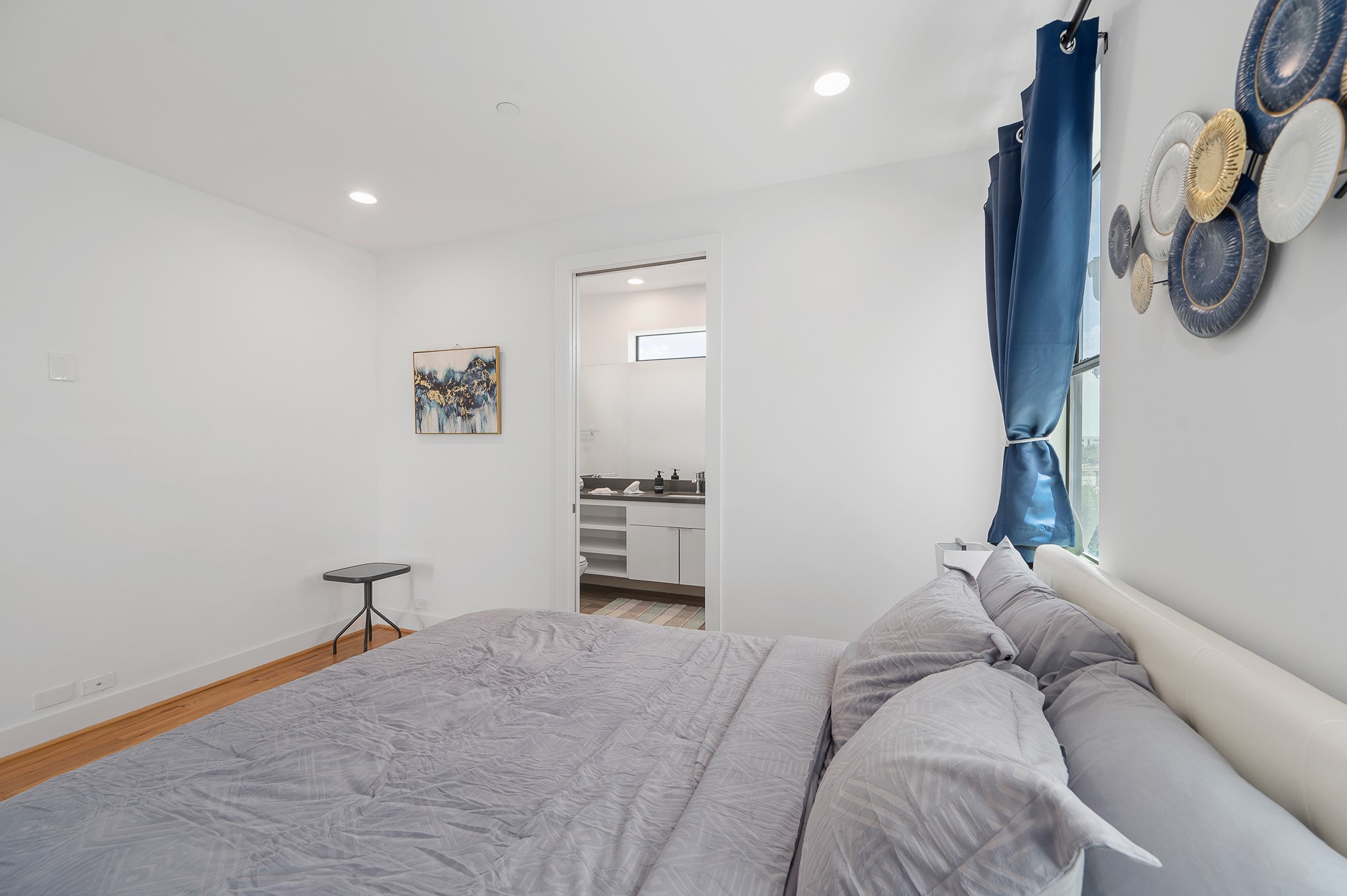2239 North MacGregor Way Houston, TX 77004 - Photo 24 of 39 a bedroom with a bed and a chandelier