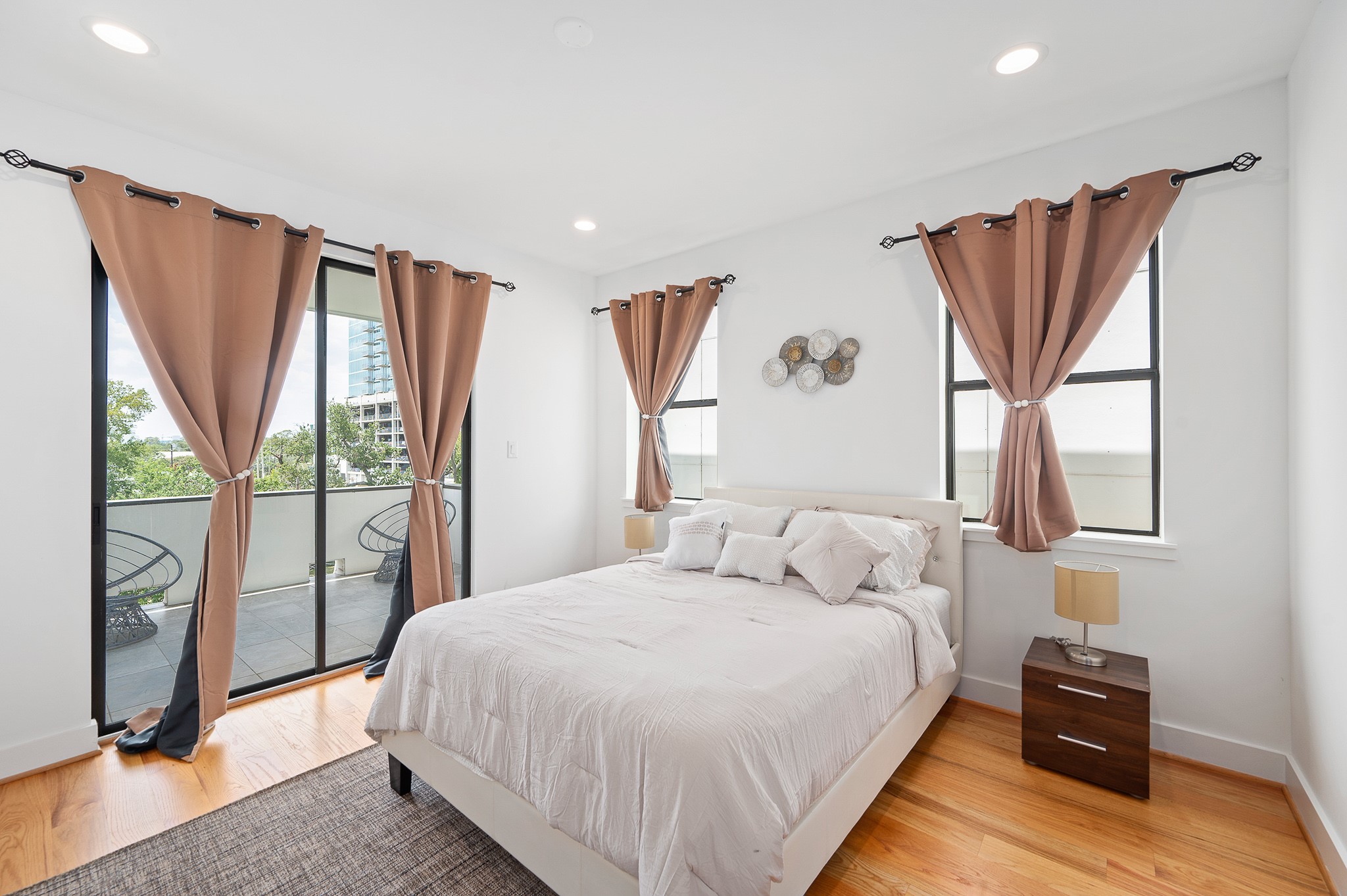 2239 North MacGregor Way Houston, TX 77004 - Photo 30 of 39 a bedroom with a bed and glass window