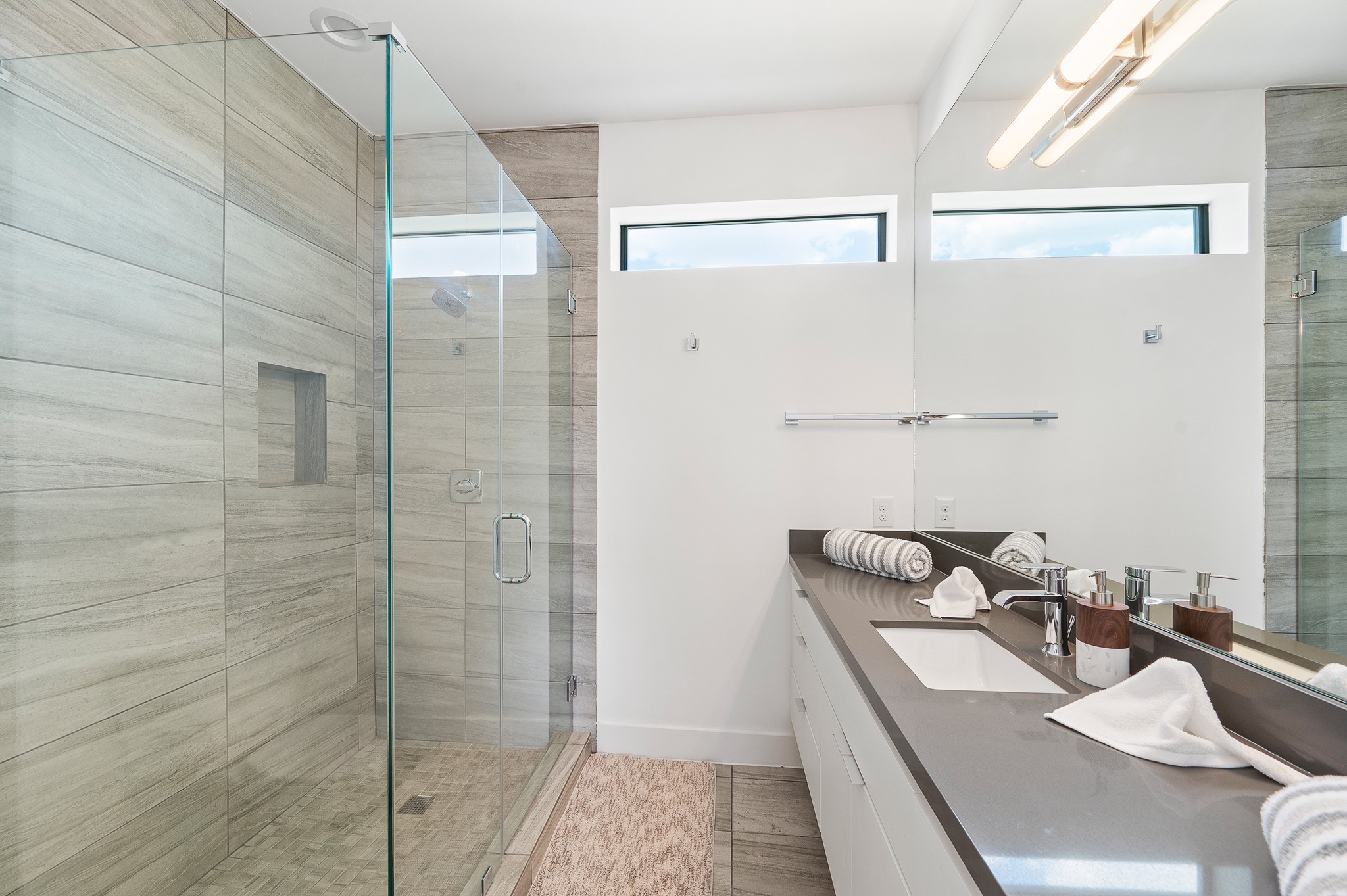 2239 North MacGregor Way Houston, TX 77004 - Photo 31 of 39 a bathroom with a granite countertop sink a mirror and shower