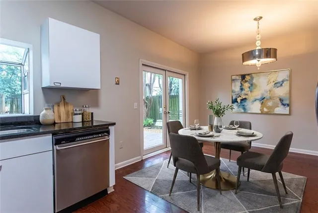 a kitchen with granite countertop stainless steel appliances and a refrigerator