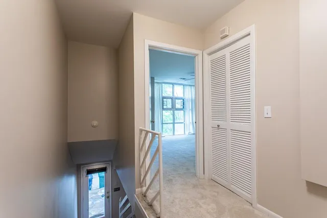 a view of a hallway with washer and dryer