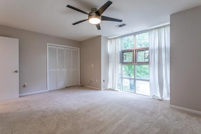 a bathroom with a bathtub shower sink vanity and toilet