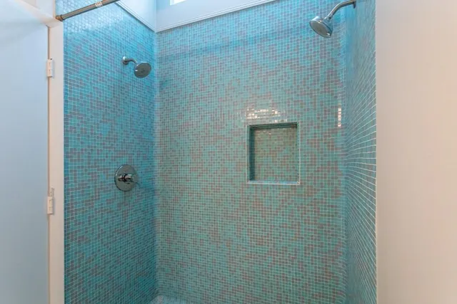 a view of staircase with white walls and a window