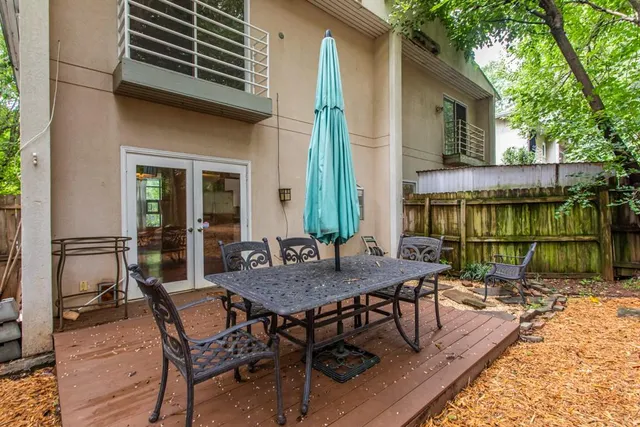 a view of a patio with a table chairs and a patio