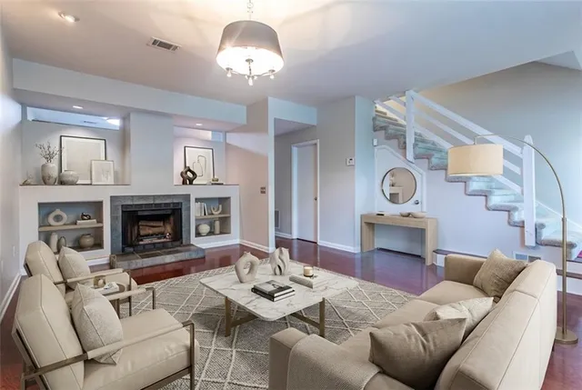 a living room with furniture and a fireplace