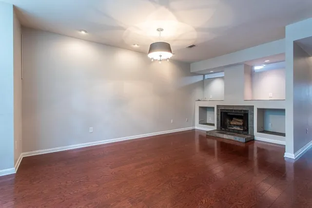 a living room with a fireplace and a fireplace