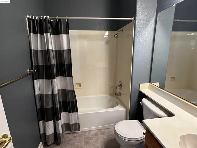 a bathroom with a toilet and a bathtub