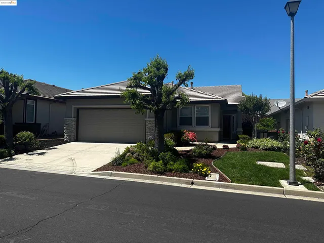 front view of a house with a garden
