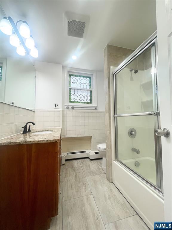 169 Magnolia Avenue, Unit 2 3 Kearny, NJ 07032 - Photo 18 of 23 a bathroom with a sink and mirror