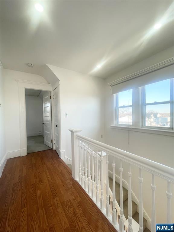 169 Magnolia Avenue, Unit 2 3 Kearny, NJ 07032 - Photo 23 of 23 a view of a hallway with wooden floor and windows