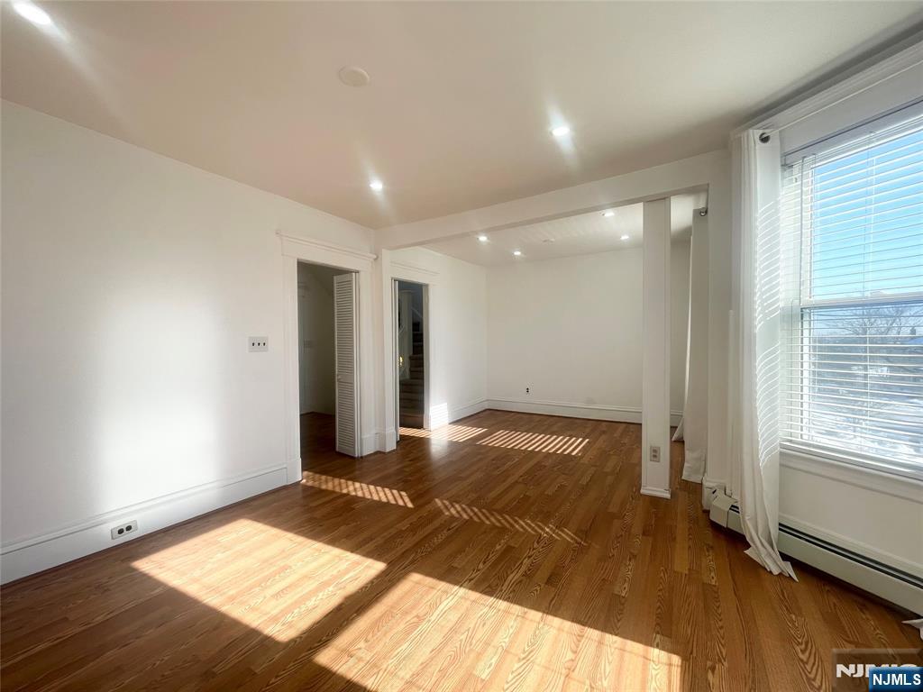 169 Magnolia Avenue, Unit 2 3 Kearny, NJ 07032 - Photo 4 of 23 a view of bedroom and bedroom with wooden floor