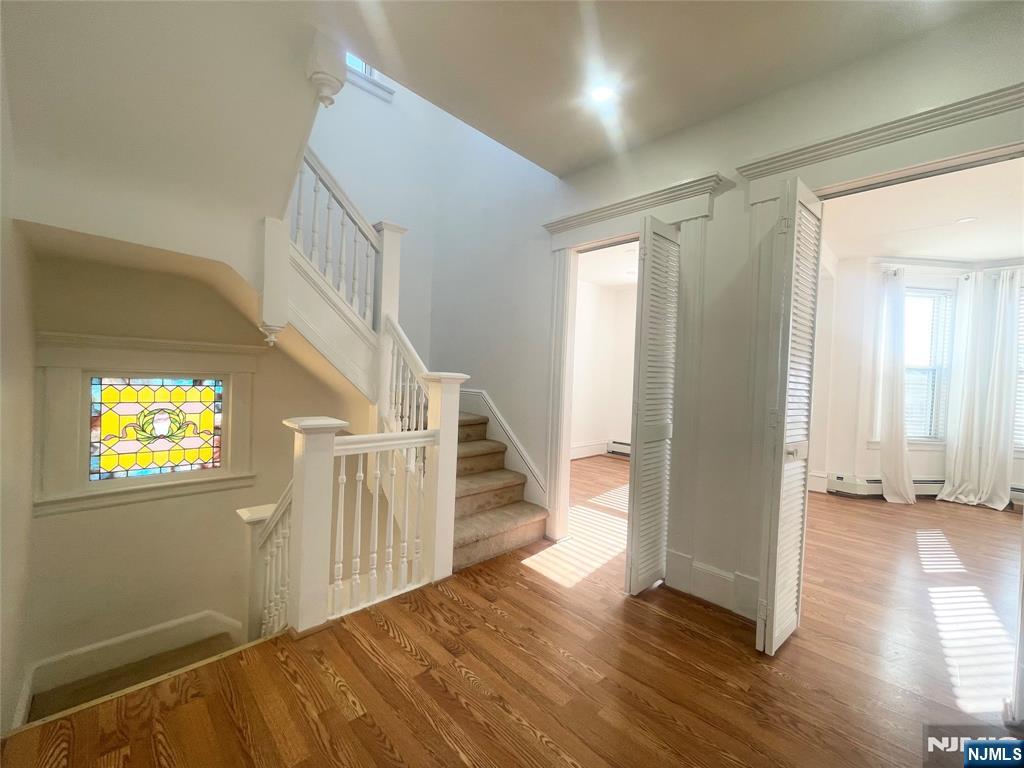 169 Magnolia Avenue, Unit 2 3 Kearny, NJ 07032 - Photo 6 of 23 a view of an entryway with wooden floor and stairs