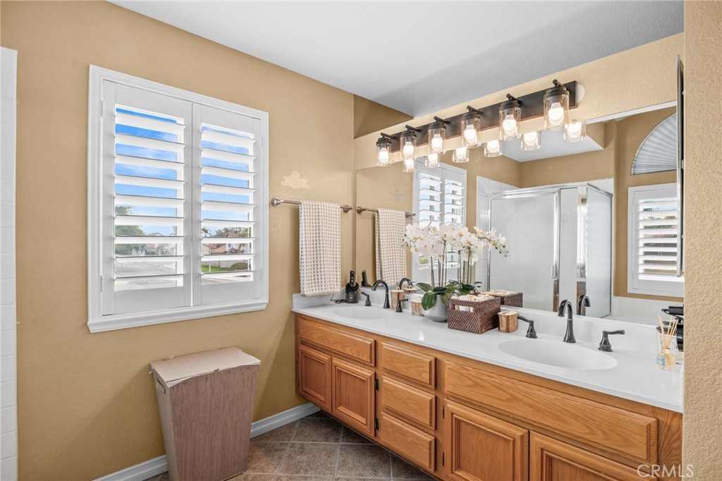 20257 Edmund Road Riverside, CA 92508 - Photo 31 of 53 a bathroom with double vanity and a mirror