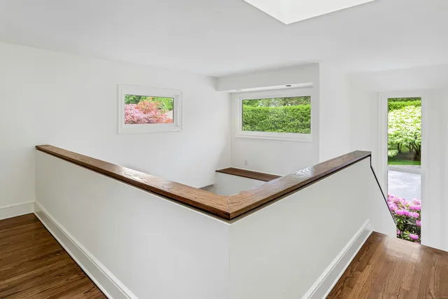 a view of a living room with a bed and a window
