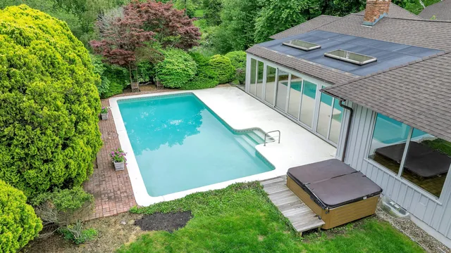 a view of a backyard with sitting area