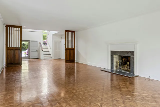 a view of an empty room with glass door