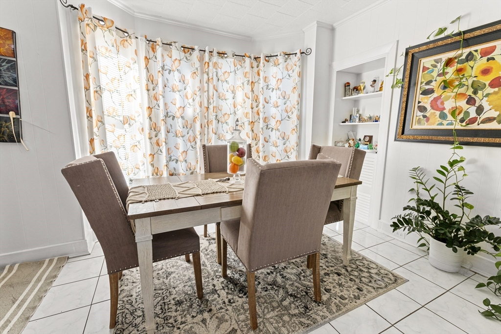 62-66 Butler Street Lawrence, MA 01841 - Photo 25 of 37 a view of a dining room with furniture window and wooden floor