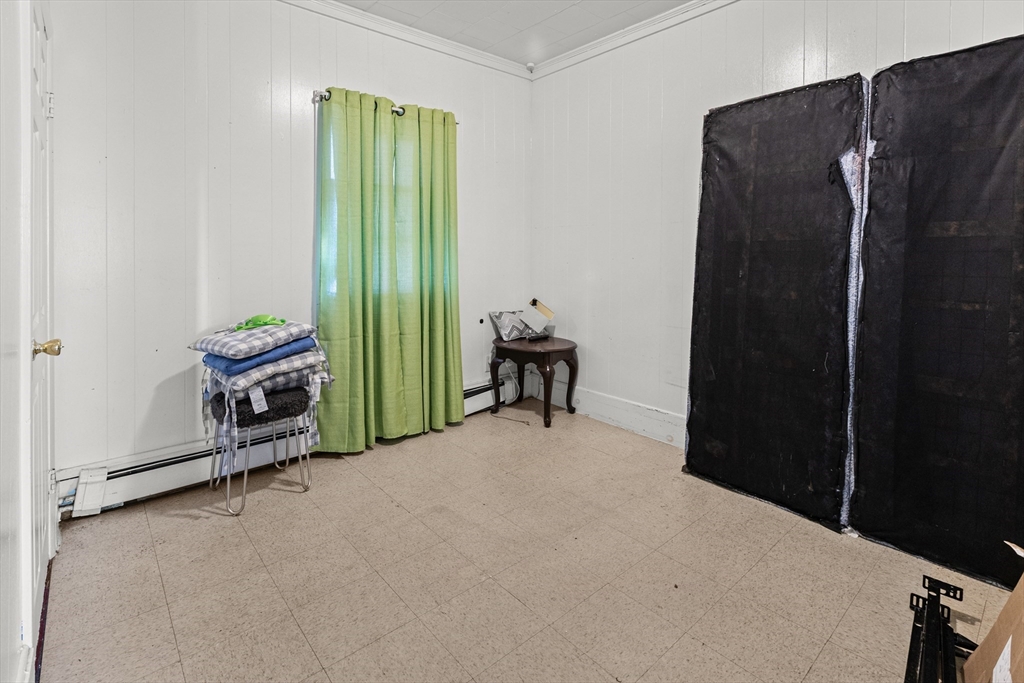 62-66 Butler Street Lawrence, MA 01841 - Photo 26 of 37 a room with walk in closet and a window