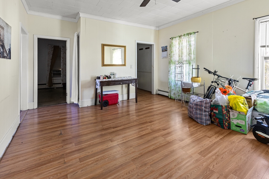 62-66 Butler Street Lawrence, MA 01841 - Photo 37 of 37 a room with furniture and a wooden floor