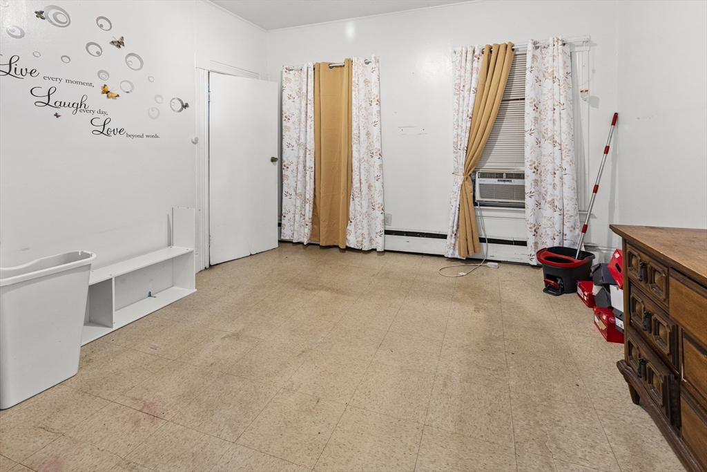 62-66 Butler Street Lawrence, MA 01841 - Photo 6 of 37 a view of an empty room with stairs