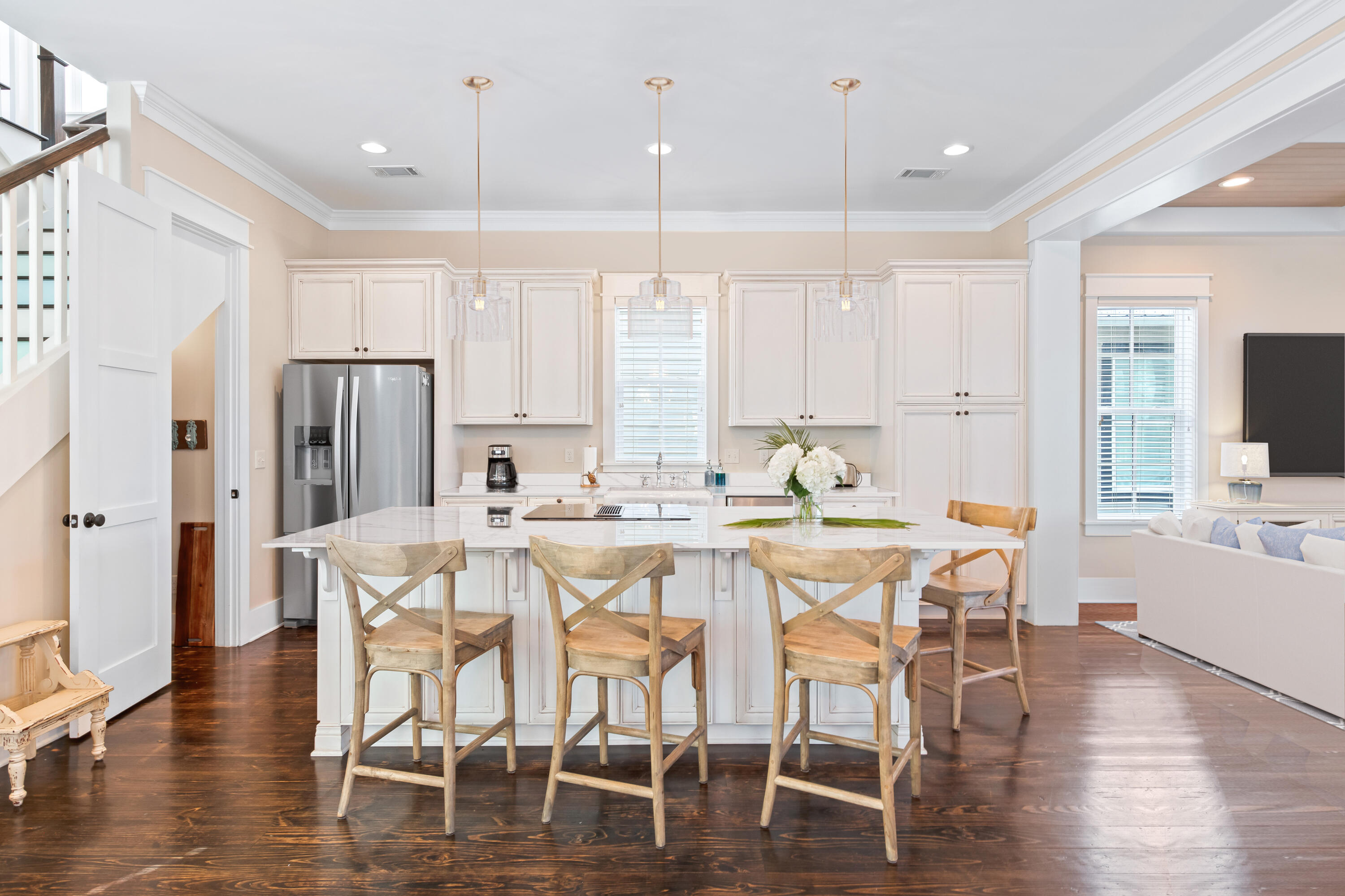113 Lifeguard Loop West Inlet Beach, FL 32461 - Photo 11 of 51 a dining room with stainless steel appliances kitchen island granite countertop a dining table chairs and white cabinets