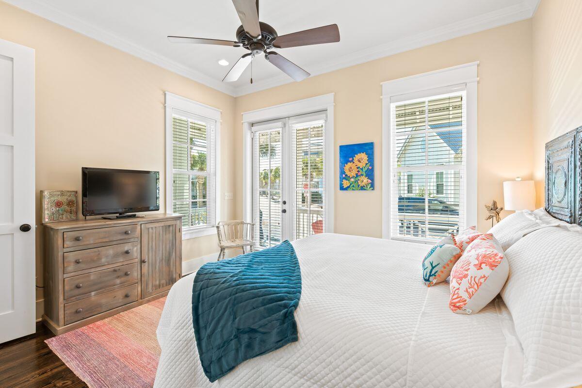 113 Lifeguard Loop West Inlet Beach, FL 32461 - Photo 15 of 51 a bedroom with a large bed and a flat screen tv