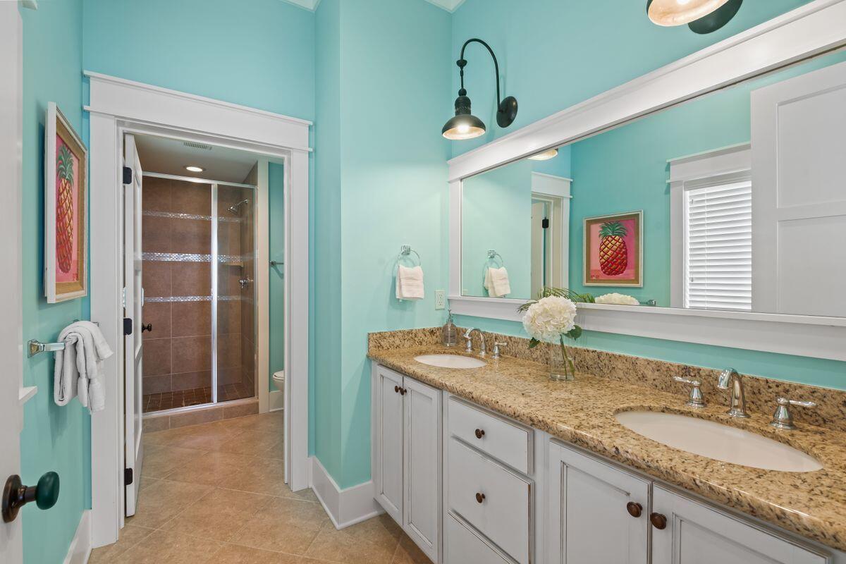 113 Lifeguard Loop West Inlet Beach, FL 32461 - Photo 17 of 51 a bathroom with a granite countertop sink and a mirror