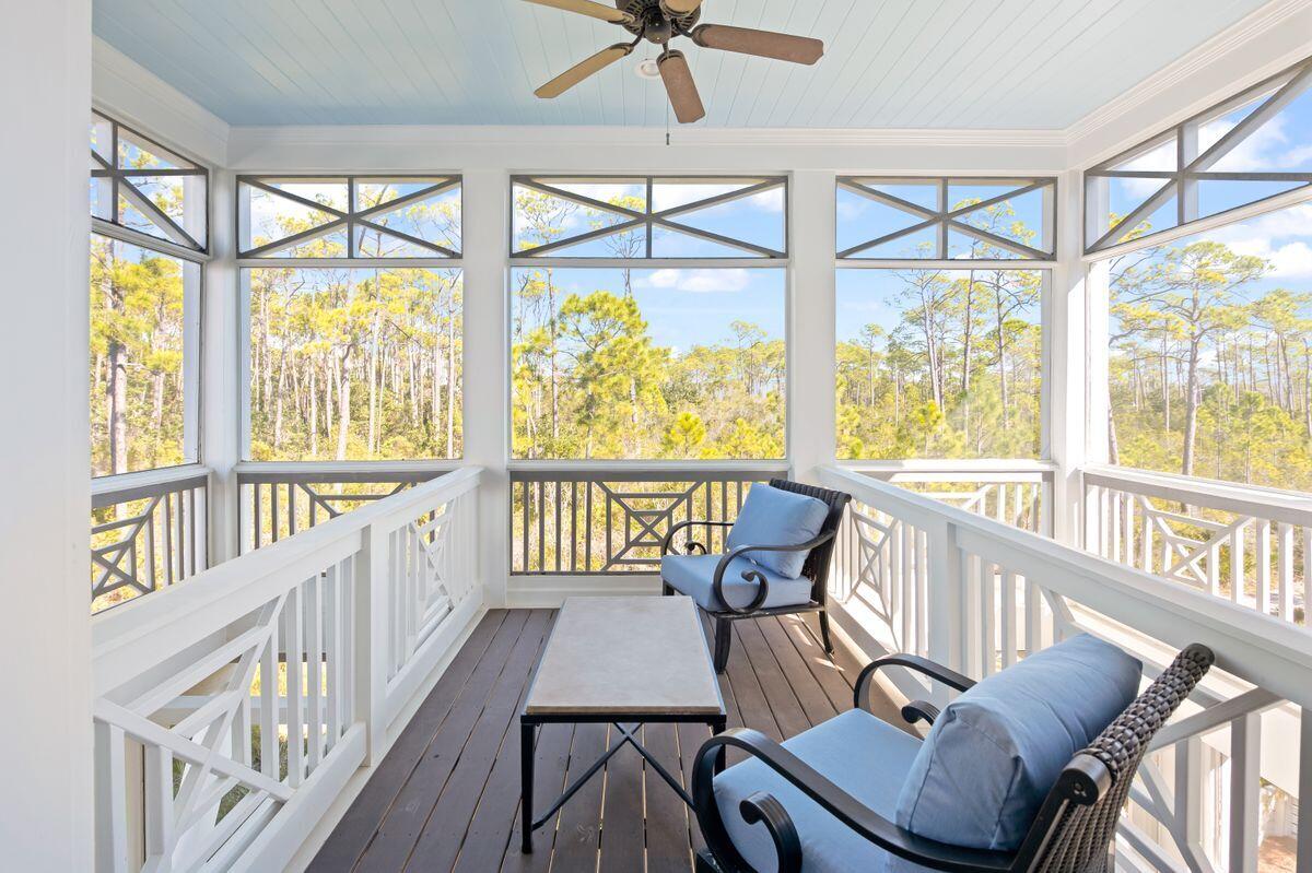 113 Lifeguard Loop West Inlet Beach, FL 32461 - Photo 30 of 51 a view of a chairs and table in balcony