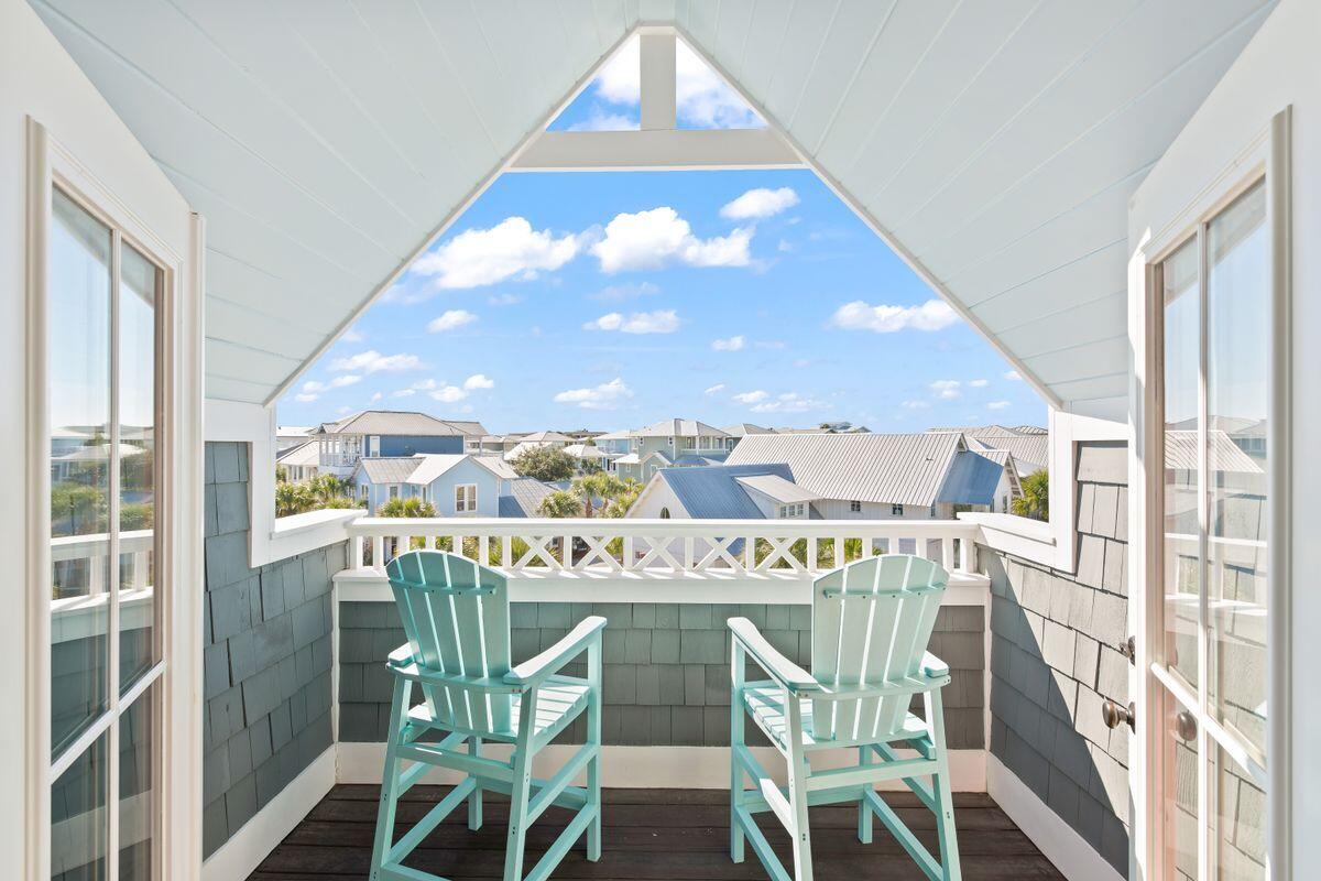113 Lifeguard Loop West Inlet Beach, FL 32461 - Photo 35 of 51 a view of a dining room with furniture a chandelier and wooden floor