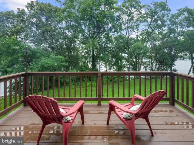 a view of a wooden deck with a bench