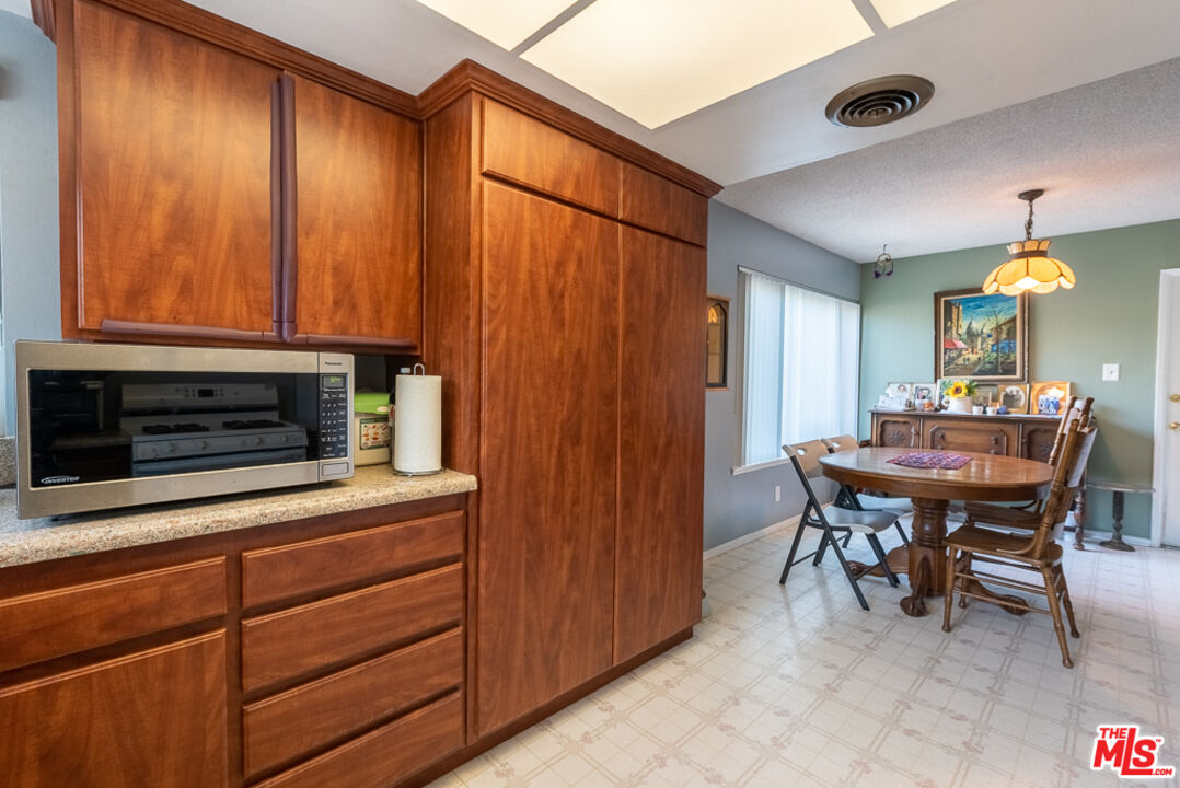 1637 Downing Street Simi Valley, CA 93065 - Photo 14 of 26 a kitchen with a table and chairs in it