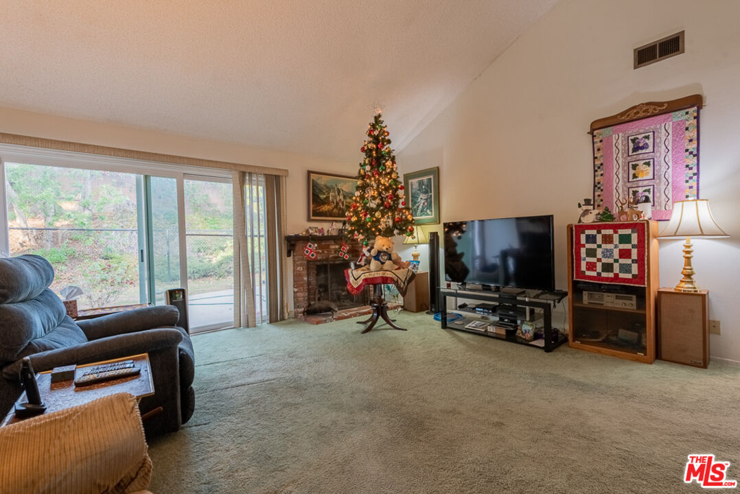1637 Downing Street Simi Valley, CA 93065 - Photo 17 of 26 a view of a livingroom with furniture and a flat screen tv