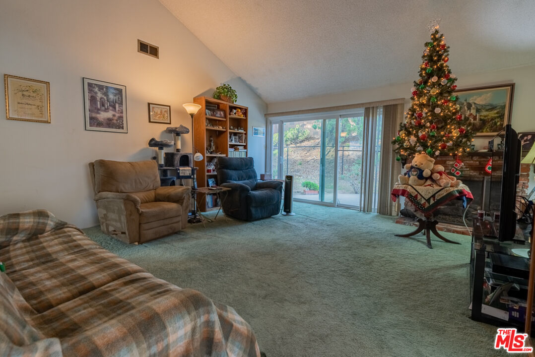 1637 Downing Street Simi Valley, CA 93065 - Photo 18 of 26 a bed room with a bed and a couch
