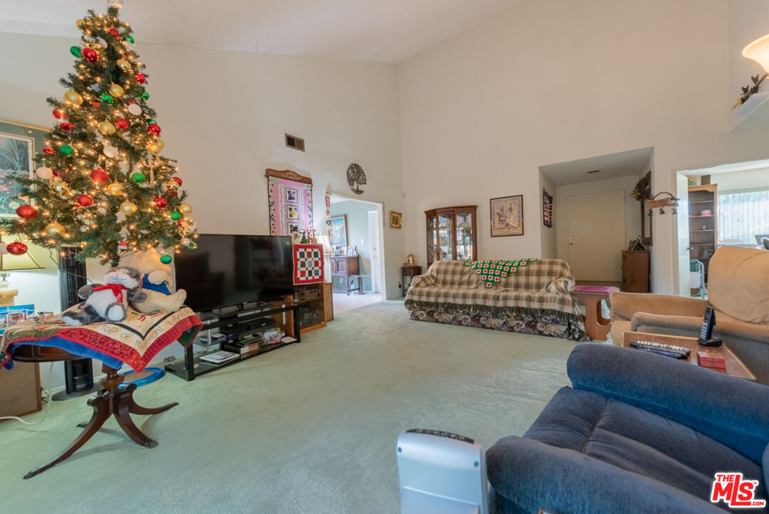 1637 Downing Street Simi Valley, CA 93065 - Photo 19 of 26 a living room with furniture a flat screen tv and a large window
