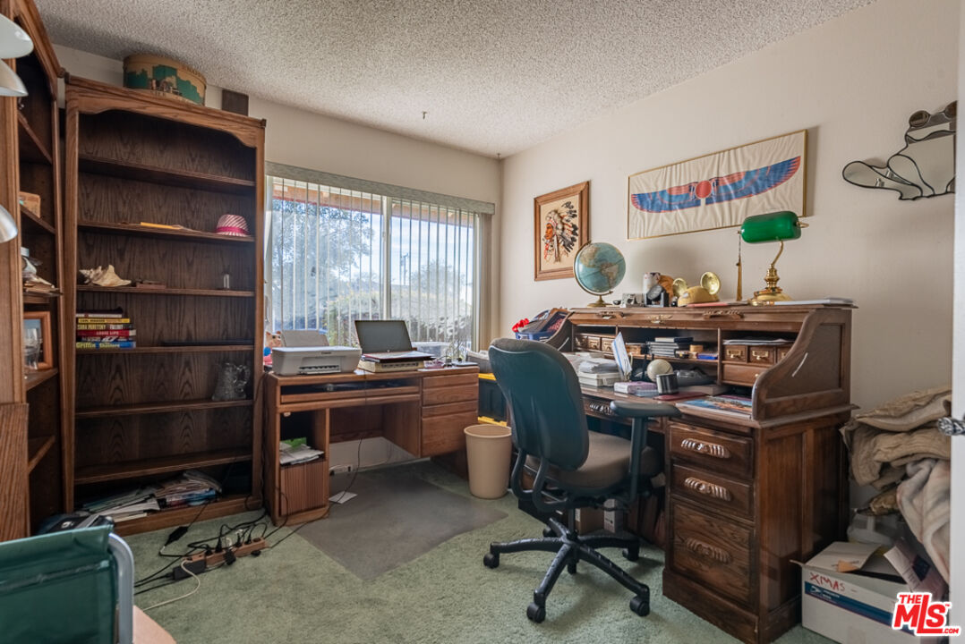1637 Downing Street Simi Valley, CA 93065 - Photo 20 of 26 a view of a workspace with furniture and a window